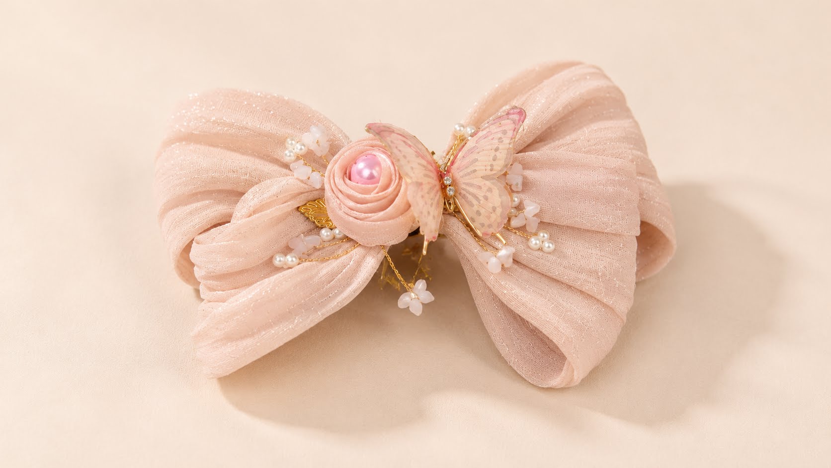 Delicate pink bow with pearl accents