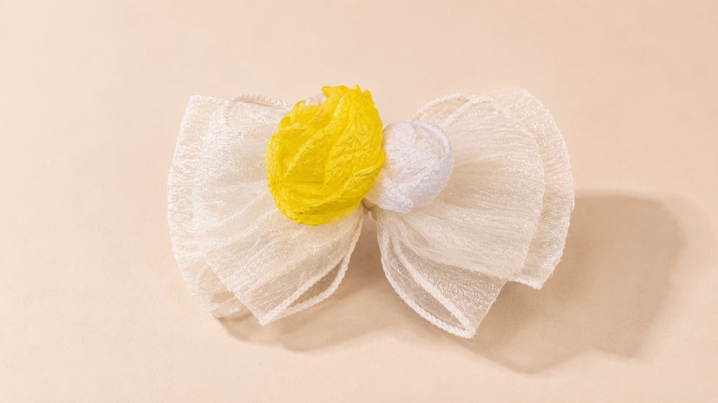 Elegant fabric bow with yellow accent
